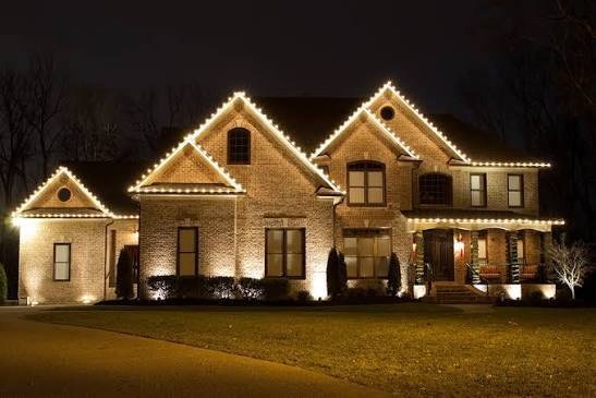 Classic estate outlined in warm white C9 roofline lights